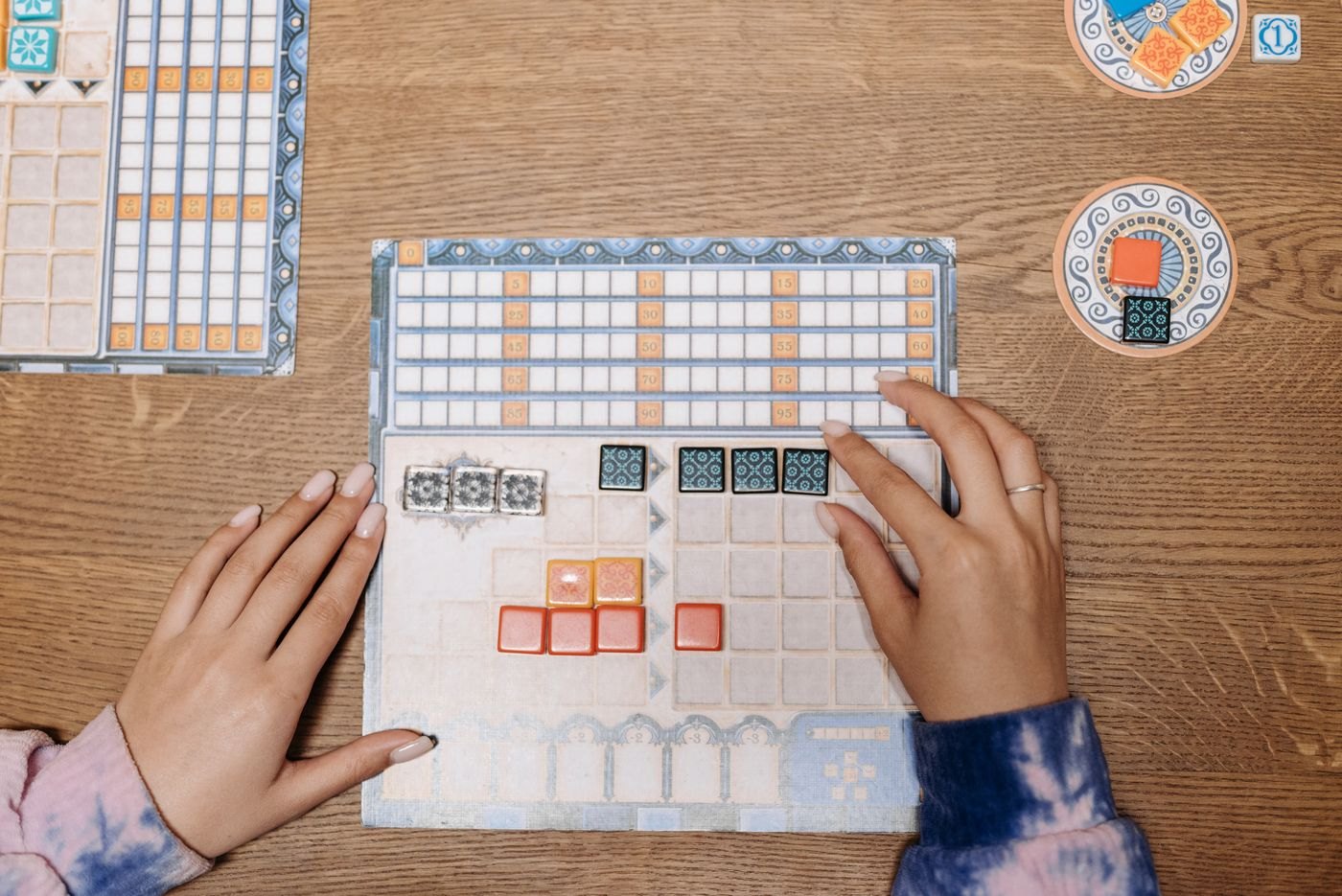 A player board with tile patterns and a score track
