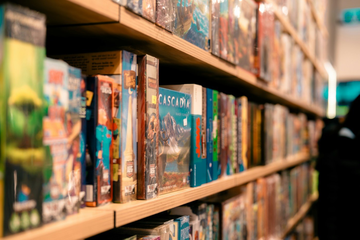Shelves filled with different boxed board games