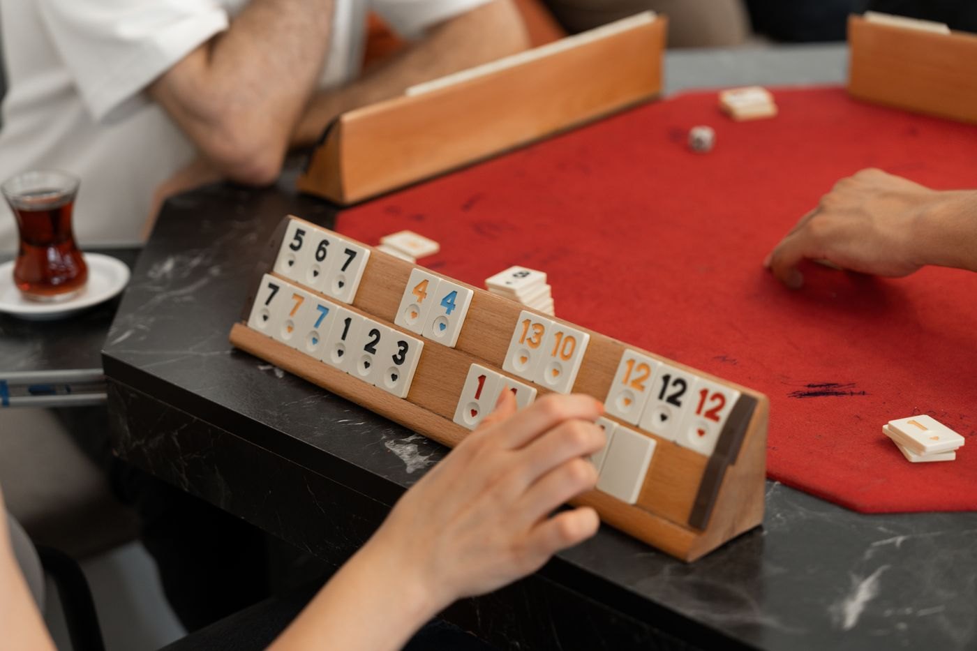 Numbered tiles grouped on a wooden rack