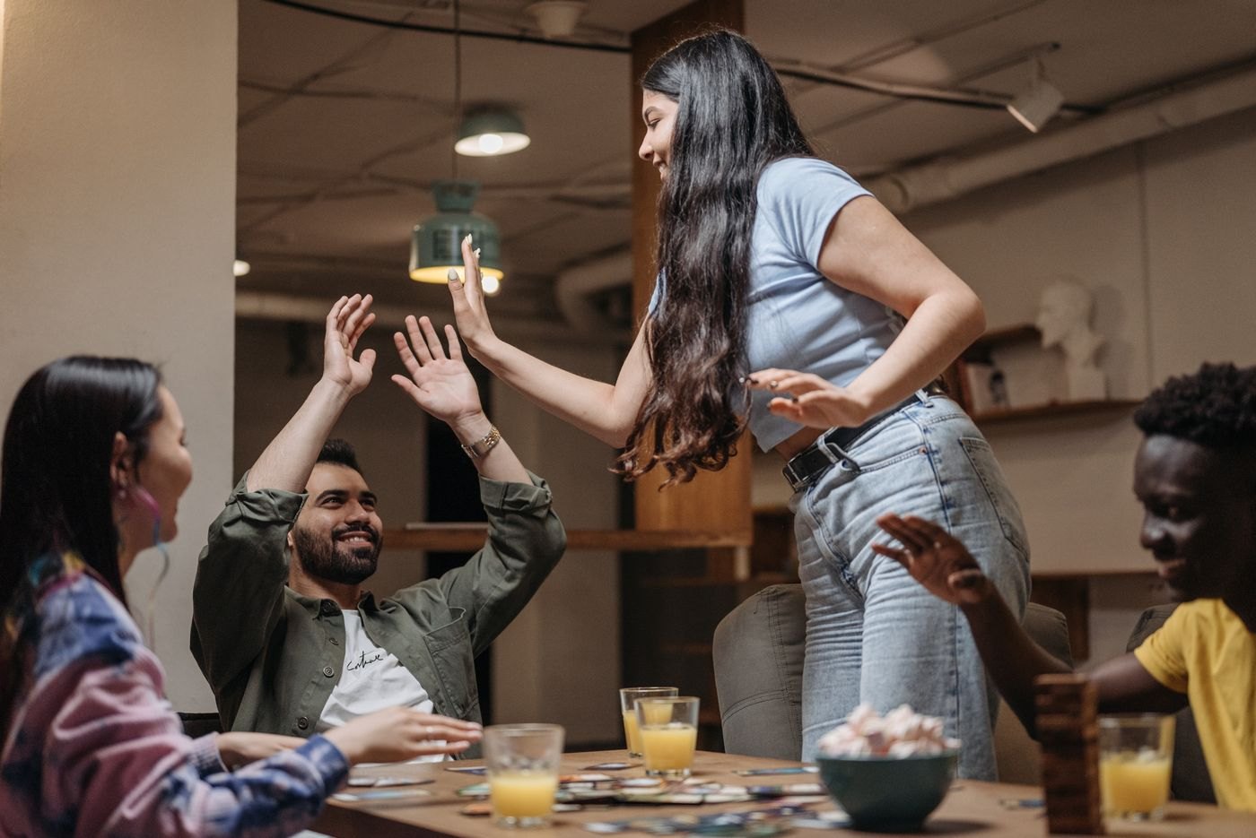 Friends celebrating over a tabletop game